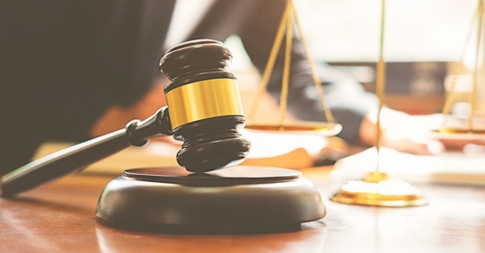 gavel and lawyer in the background